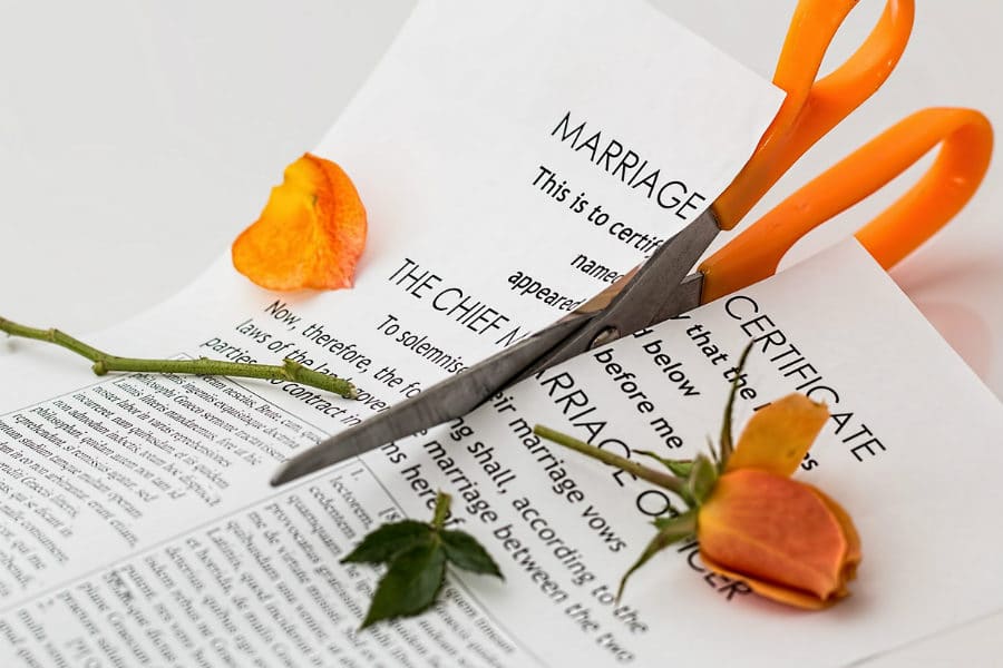 Marriage certificate being cut in half